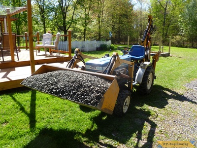 carrying a load of stone. palram 6 x 10 greenhouse project