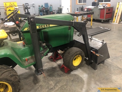 Dan W. Eureka IL loader frame with bucket below grade