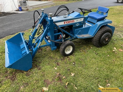 Patrick C. Ford LGT 145 pin-on mini payloader left side with pump