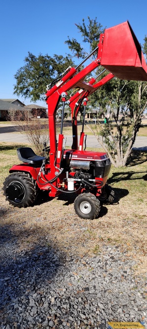 Don A. and his Wheelhorse 310-8 loader in Thibodaux, LA bucket raised right side